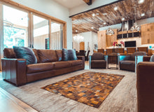 Jean tag quilted rug displayed inside beautiful home. 