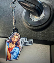 Keychain with religious figure resembling Jesus 