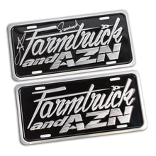 two license plates with farmtruck and azn logo embossed on them