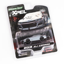 Greenlight XPEL 2018 ZL Camaro die-cast model car in its original blister packaging, featuring a silver and white race-lapped car design.