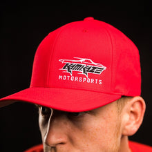 Red cap with 'Kamikaze Motorsports' logo worn by a person against a black background