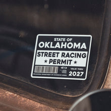 Oklahoma street racing permit sticker on a vehicle window