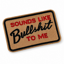 A rectangular embroidered patch with a tan background, black border, and text reading 'SOUNDS LIKE Bullshit TO ME' in red and black lettering, shown on a clean white background.