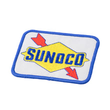 A rectangular Sunoco Race Fuels patch with blue, yellow, and red colors featuring the Sunoco logo with blue arrows on a white background.