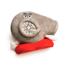 A plush stuffed pillow designed to resemble a turbocharger with a face and eyes, primarily in gray color with red accents.